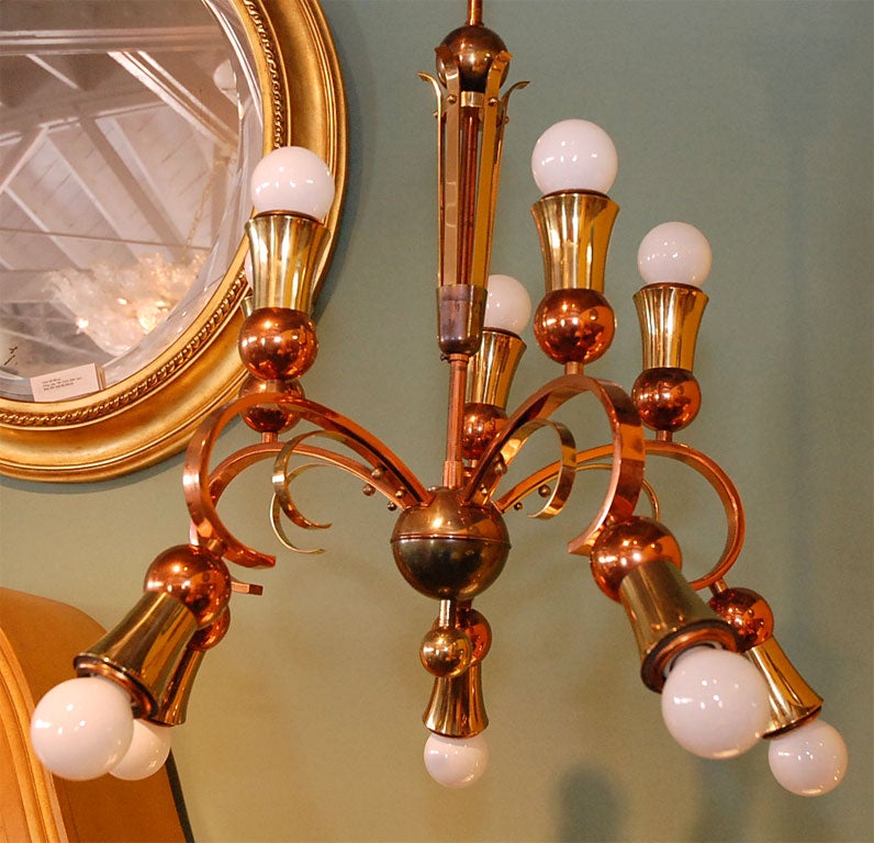Elegant and unique brass and copper chandelier, possibly German or Austrian. See last photo as lit with clear bulbs. From canopy total drop is 46 inches. Measurements given are for the chandelier including bulbs, see last photo as lit with clear